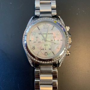Silver woman’s Micheal Kors watch